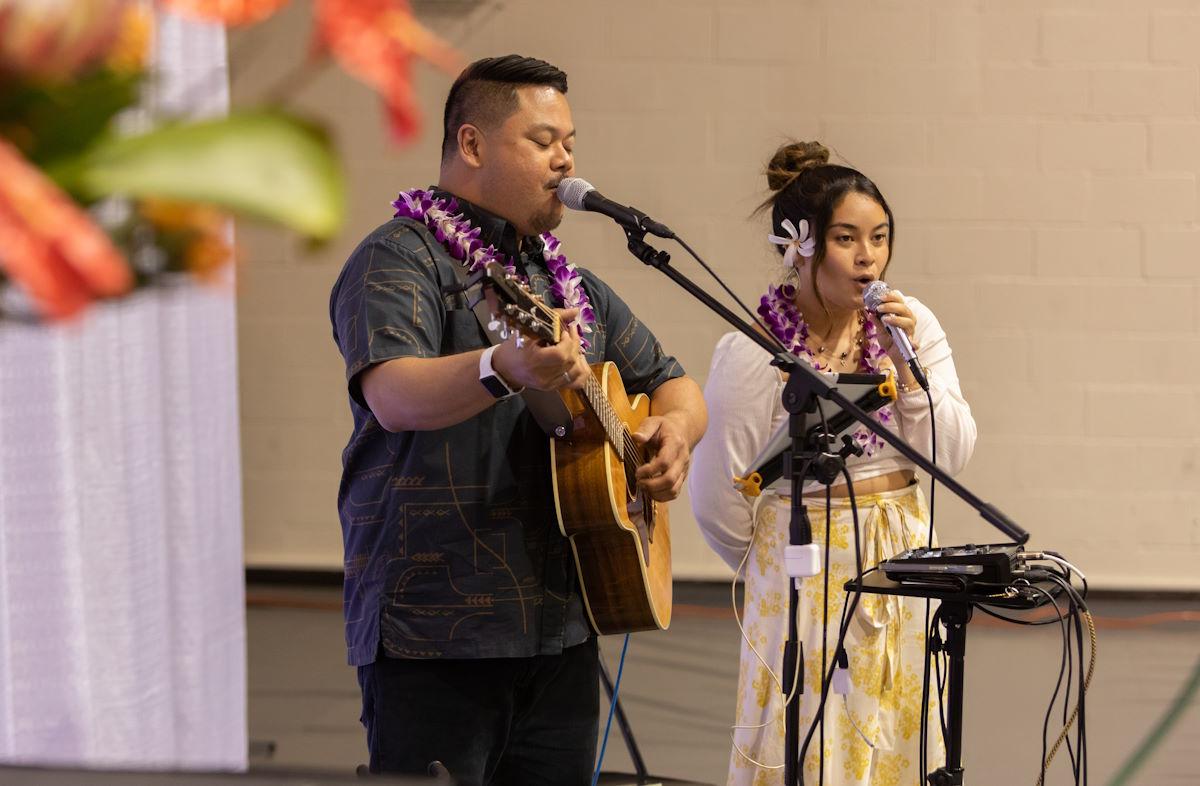 Students sing and play guitar